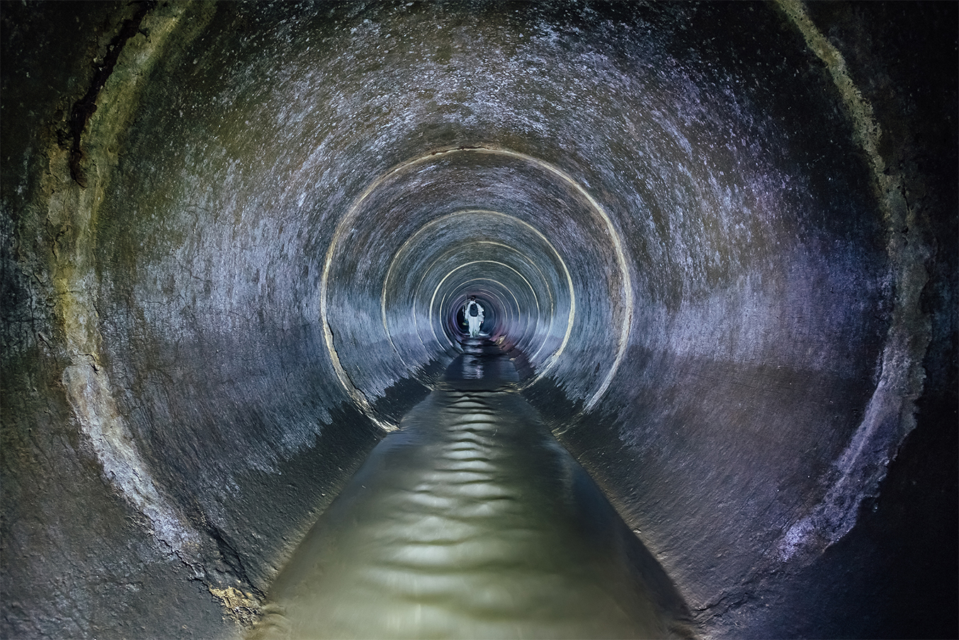 Person inside sewer_1354x903.jpg